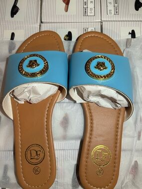 Women's Blue Slide Mules with Gold Medallion